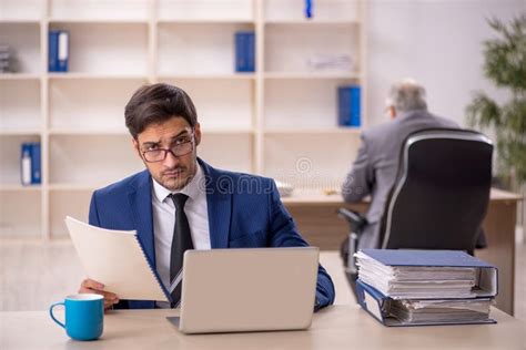 Old Male Boss And Young Male Employee In The Office Stock Image Image