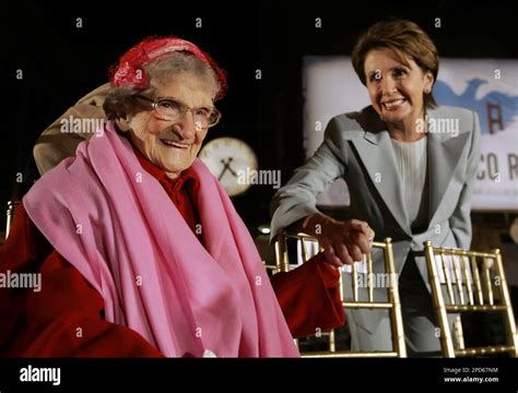 Earthquake survivors Frances Duffy, 100, left, is greeted by House