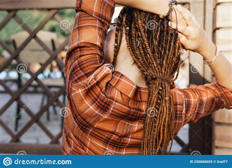 A Girl With A Dreadlocked Hairstyle Poses In Summer Outdoor Bright
