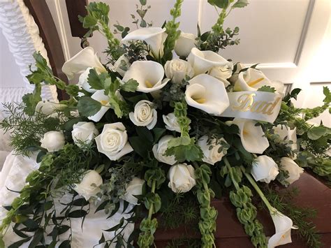 white calla lilies and roses casket spray funeral spray flowers funeral flower arrangements