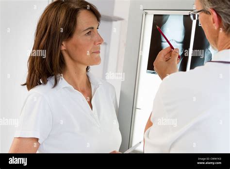 Doctor And Nurse Examining X Rays Stock Photo Alamy
