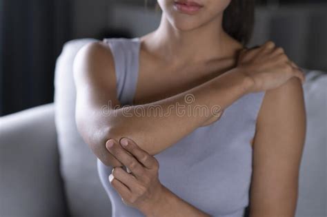 Asian Woman Wearing Casual Clothes Having Pain In Her Elbow Stock Image