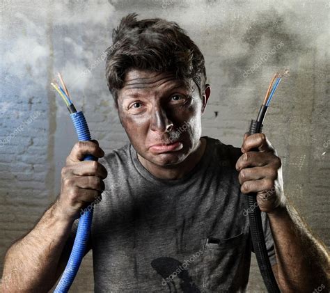 Untrained Man Joining Electrical Cable Suffering Electrical Accident With Dirty Burnt Face In