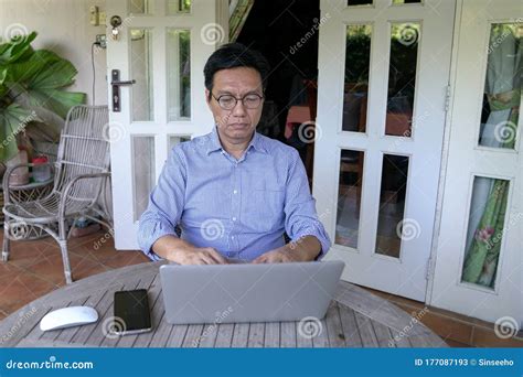 Asian Chinese Businessman On The Computer Work From Home Stock Image