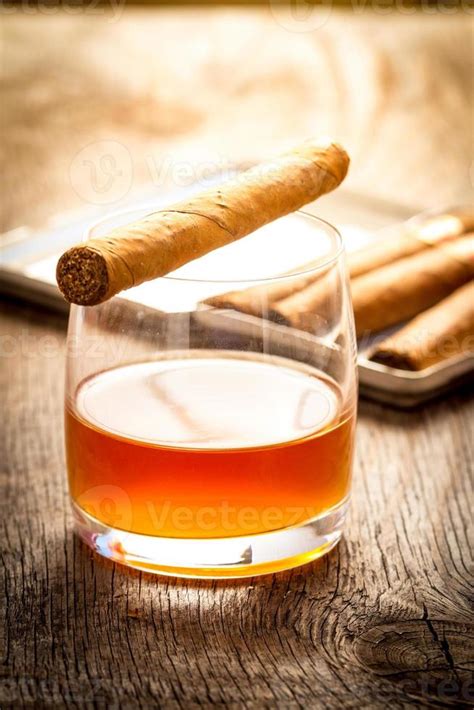 Cuban Cigars On Wooden Table With Glass Of Rum 725776 Stock Photo
