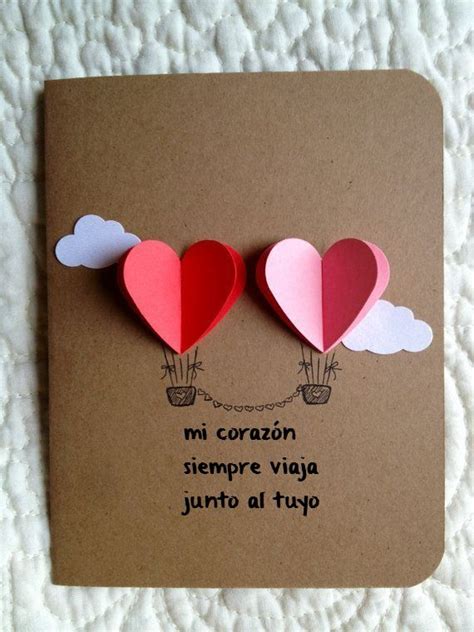 Two Hearts Shaped Like Hot Air Balloons On A Card With The Words Mi