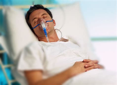 Portrait Of A Man With An Oxygen Mask In A Hospital Bed Metro Uk