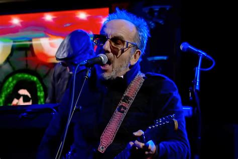 elvis costello performs “farewell ok ” “peace” on colbert rolling stone