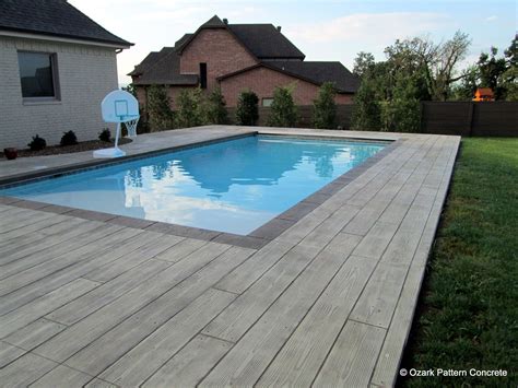 It is widely used in surfaces like. Concrete Pool Deck in Wood Board Pattern with Contrasting ...
