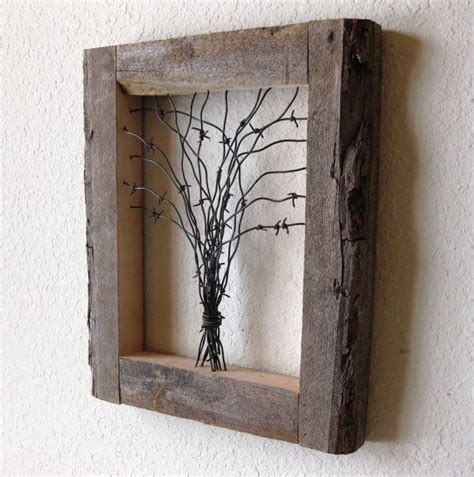 Both my dad and brother are contractors and skilled wood workers and i am lucky enough to not only learn from them but also benefit from them because and that is exactly what happened with this barn wood wall project. Nice Barn Wood Wall Decor #5 Wood And Barbed Wire Art | LaurensThoughts.com