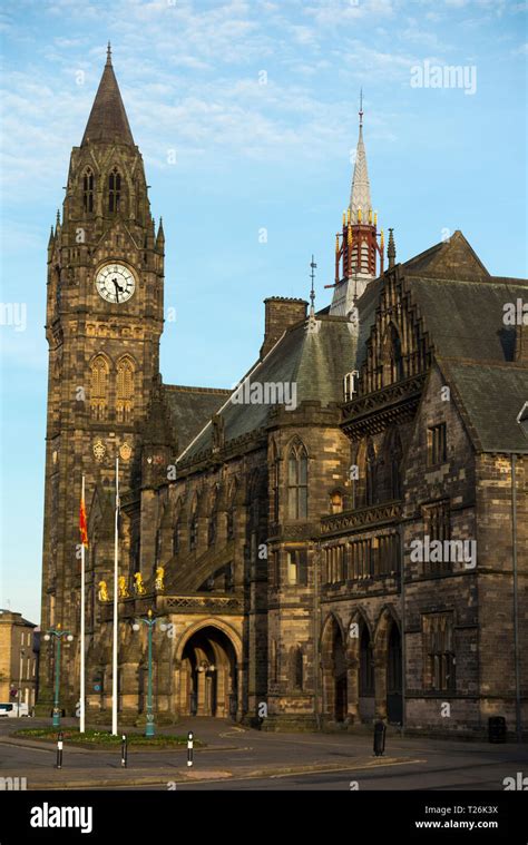 Rochdale Town Hall And Tower Clock With Blue Sky And Late Afternoon Sun