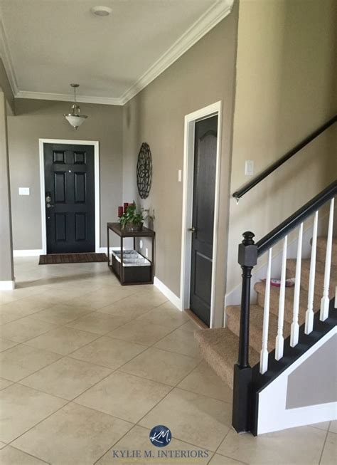 View interior and exterior paint colors and color palettes. Sherwin Williams Keystone Gray in a low light foyer and ...