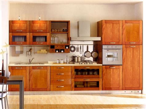 Customized modular kitchen design suits the client's lifestyle and fits perfectly in the space. Kerala kitchen cabinets photo gallery
