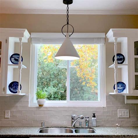 Pendant lighting is mounted to the ceiling and hangs on either a rod or chain. Simple Kitchen Update: Pendant Over The Sink | Over kitchen sink lighting, Kitchen sink remodel ...