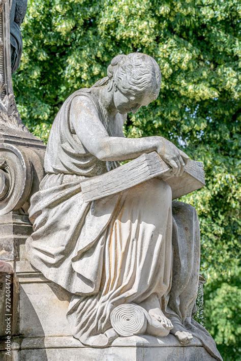 Ancient Fountain Statue Of Sensual Italian Renaissance Era Woman Reading A Big Book Magdeburg
