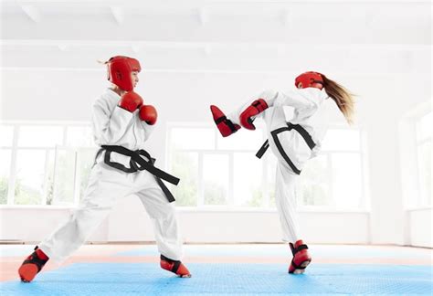 Premium Photo Two Female Fighter Practicing Karate Kick And Punch