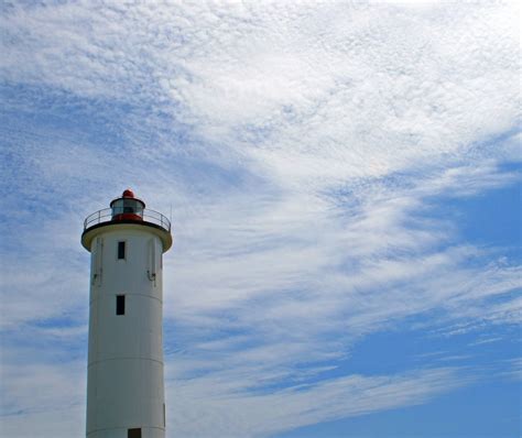 Free Images Sea Coast Cloud Lighthouse Sky White Bush Tower