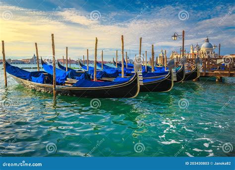 Moored Gondolas At Sunrise By Saint Mark Square Venice Italy Stock