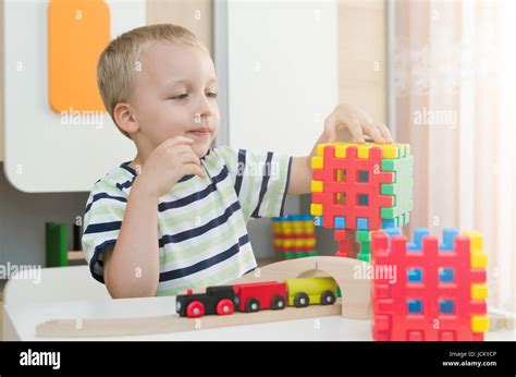 Little Boy Playing With Blocks On A Table Child Kid Young Daycare Boy