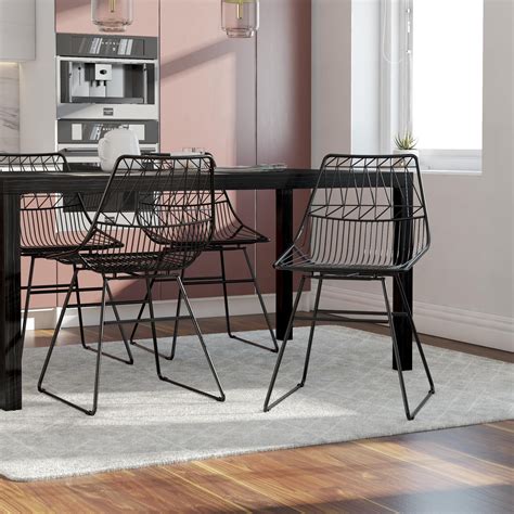 There is something so simple, so unfussy about wire dining room chairs. CosmoLiving by Cosmopolitan Astrid Wire Metal Dining Chair ...