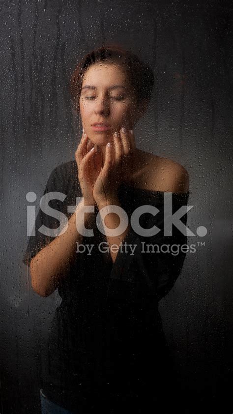 Girl Behind The Wet Glass Stock Photo Royalty Free Freeimages