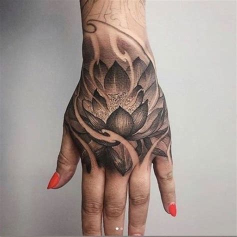 Black And Grey Lotus On Hand Hon Tattoo Hand Tattoos Hand Tattoos