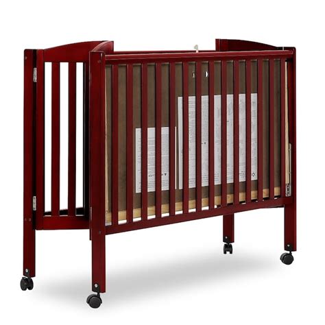 dream on me folding full size crib in cherry traditional style dark finish wood construction