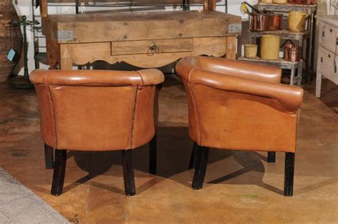 100% top grain leather on all seating areas with leather splits on outside. Pair of Italian Vintage Caramel Leather Club Chairs with ...
