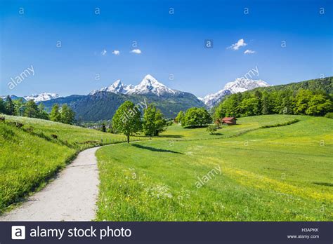 Green Landscape With Mountains And Clouds Hi Res Stock Photography And