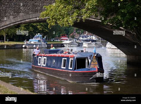 Houseboat Passing Under Abingdon Bridge England Stock Photo Alamy