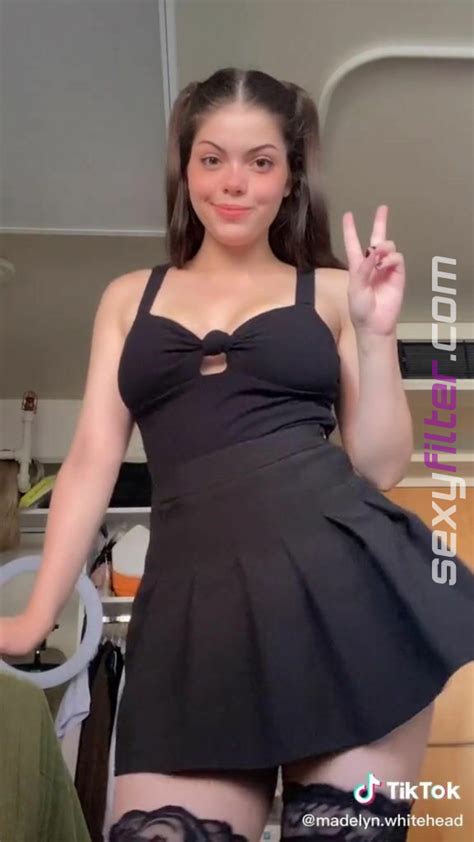 sexy madelyn shows cleavage in black dress