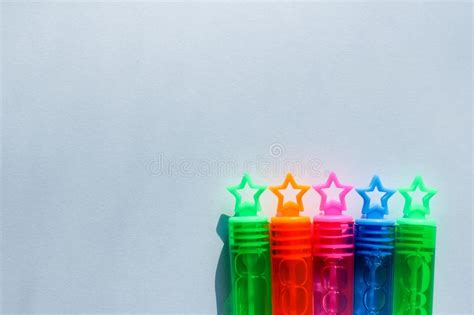 Five Colored Stars On The Lids Of The Bottles Background For Holidays