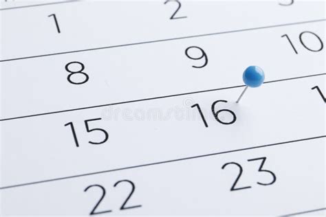 Blue Pin On A 16th Date On A Calendar Close Up Important Date Stock