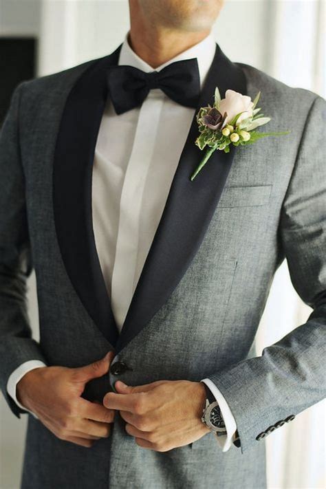 Try this tie for blue suit, because a black suit enhanced by the boldness of a black tie is a rare sight. grey and black groom suit wedding ideas - EmmaLovesWeddings