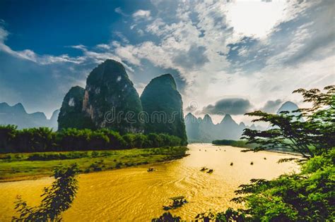 Boats On Li River In Yangshuo China Surrounded By Karst Mountains Stock