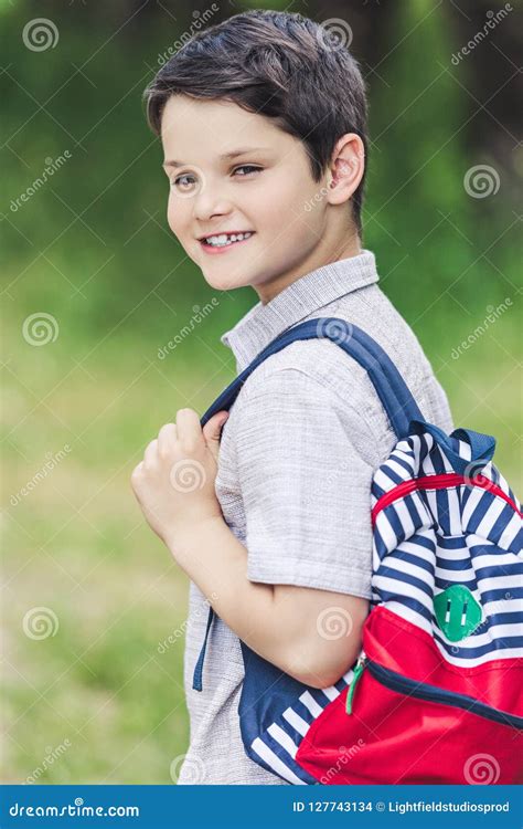 Close Up Portrait Of Happy Schoolboy With Backpack Looking Stock Photo