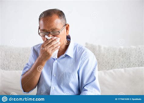 Sick Asian Old Man Using Tissue Paper Close Mouth While Cough Sitting