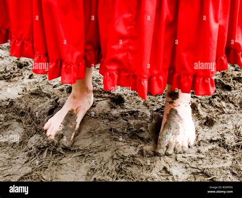 Woman Walking Barefoot In Mud Glastonbury Festival Pilton U K Europe