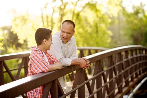 Father And Son On A Bridge