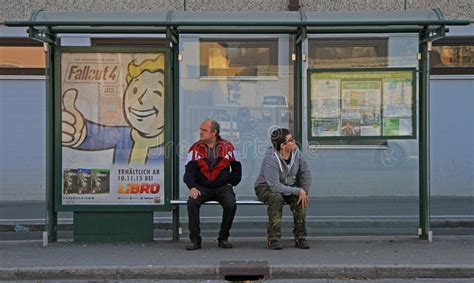 Two Men Are Waiting Transport At The Bus Stop Editorial Image Image Of Graz Public 65299895