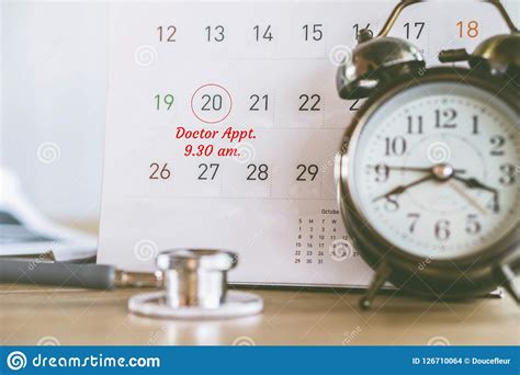 Doctor Appointment Concept With Alarm Clock And Calendar Reminder Note