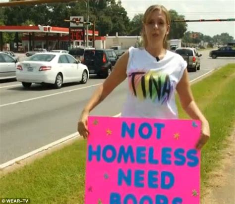 Woman Takes To Busy Roadside With A Sign Begging For Bigger Boobs