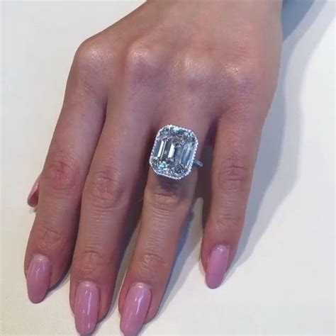 This 15ct Dif Emerald Cut Diamond In This Exquisite Dainty Setting Has