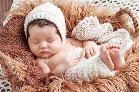 Premium Photo Beautiful Little Newborn Baby Sleeping With Knitted Plaid