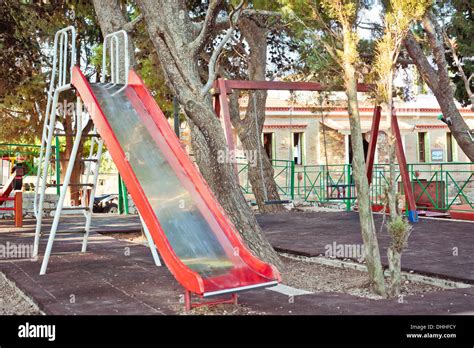 Slide And Swings In A Childrens Playground Stock Photo Alamy