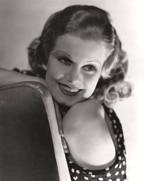 An Old Black And White Photo Of A Woman With Polka Dots On Her Dress Smiling