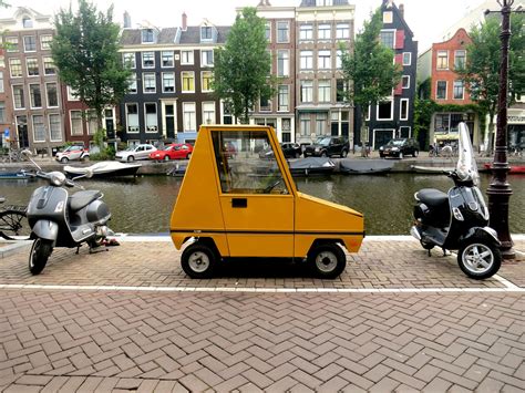 Amsterdam The Netherlands Quirky Bikes And Cars Kid See