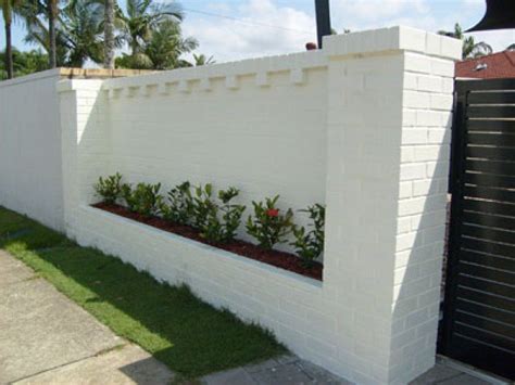 Heres A White Brick Fence With Built In Landscaping Backyard Ideas