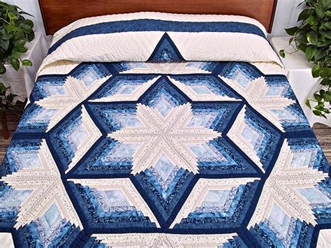 And i discovered on our site i've done lots of different log cabins but not just the standard so in the pattern they tell you all the measurements for all the pieces and you will know that you need this many 4 ½ inch pieces and this many 6 ½ pieces. Blue and Cream Diamond Star Log Cabin Quilt