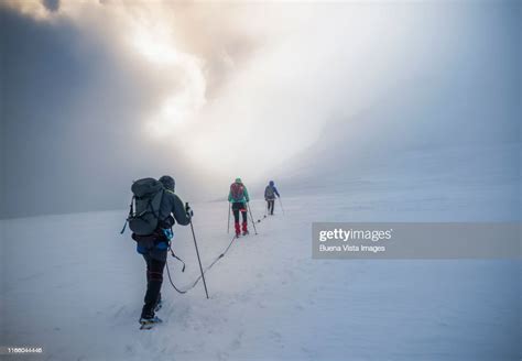 Climbers On A Snowy Slope High Res Stock Photo Getty Images